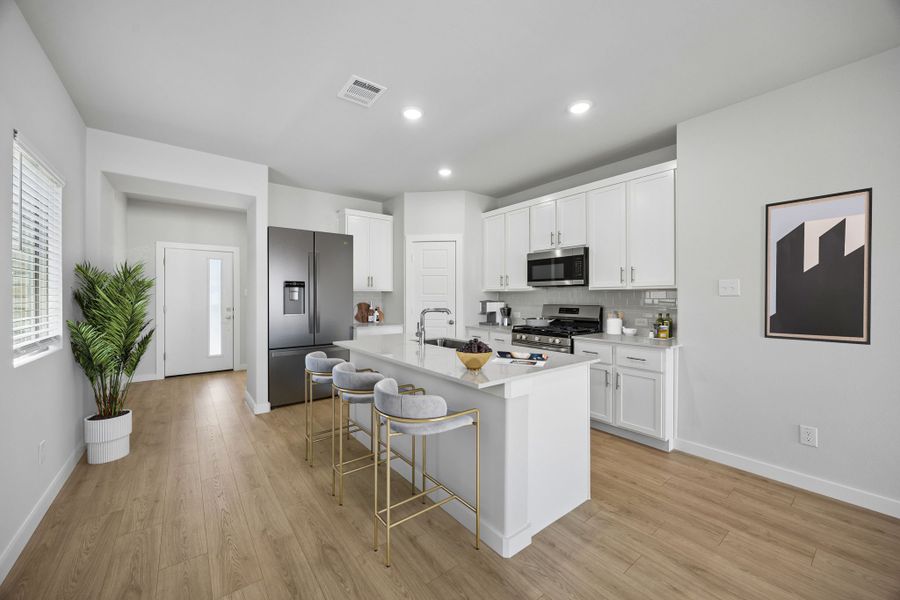 Kitchen in the Birch home plan by Trophy Signature Homes – REPRESENTATIVE PHOTO