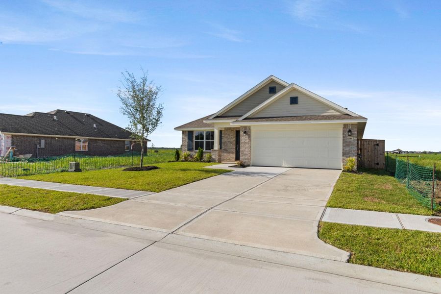 Front exterior of a new home in River Ranch Trails, Dayton, TX, highlighting curb appeal (Image 2).