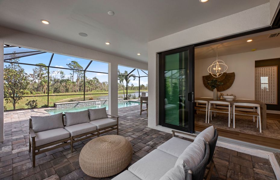 Covered lanai with with zero corner sliding glass door & café dining space access