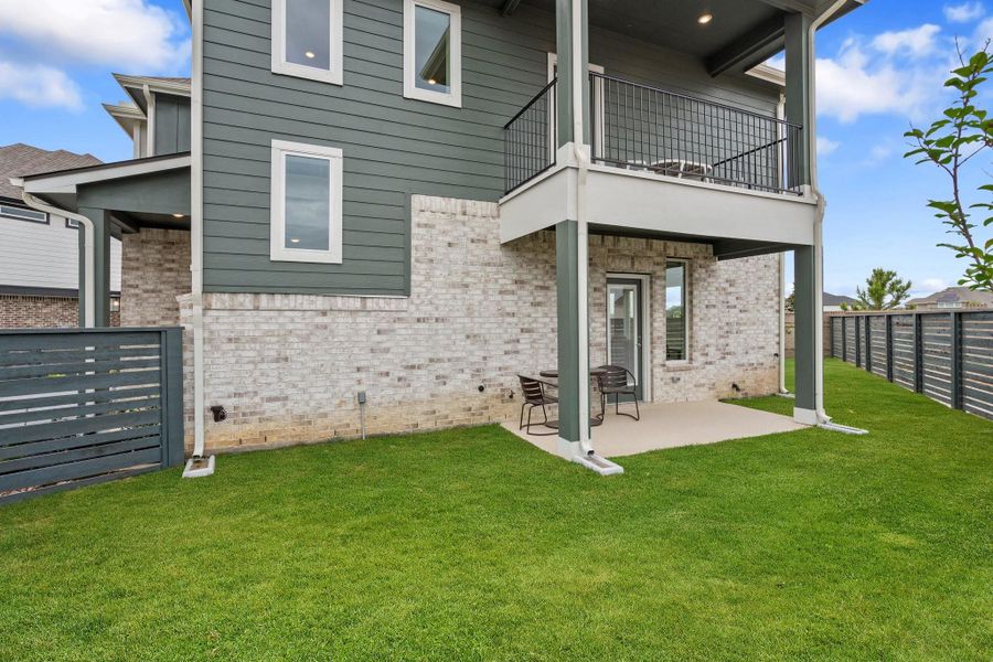 Exterior details and patio area of a home in Bridgeland Courtyard, Cypress (Image 20).