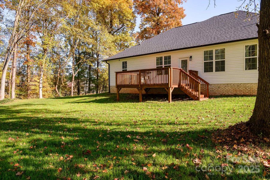 Beautiful stained deck overlooking the large back yard!