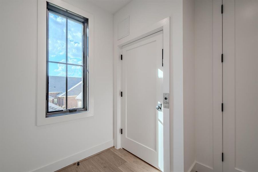 Entryway with wood finished floors and baseboards Entryway with wood finished floors and baseboards