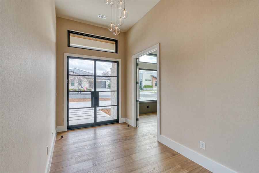 Highlighted by custom double eight-foot steel doors wood flooring throughout the house except baths and laundry.