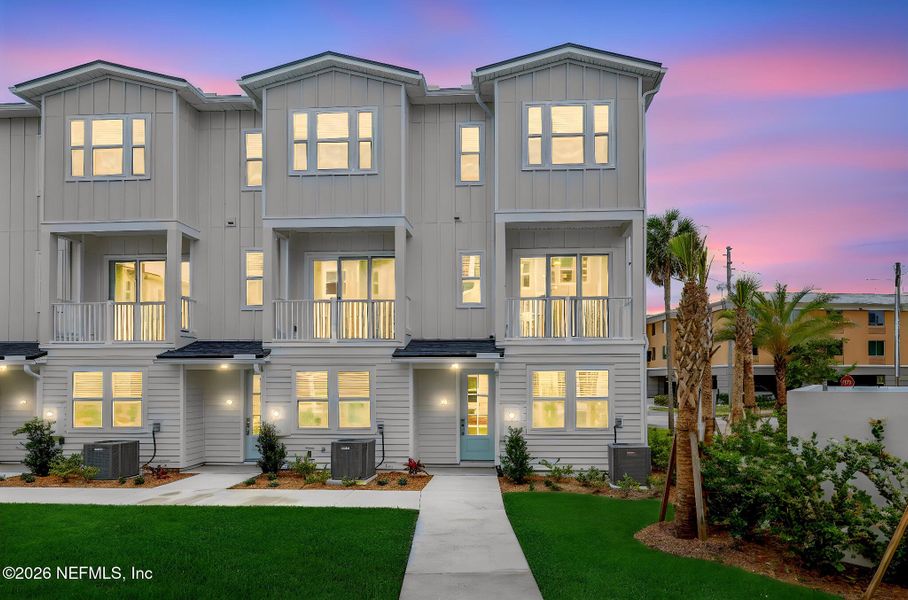 Front exterior of a new home in North Beach Townhomes, Jacksonville Beach, FL, highlighting curb appeal (Image 23).