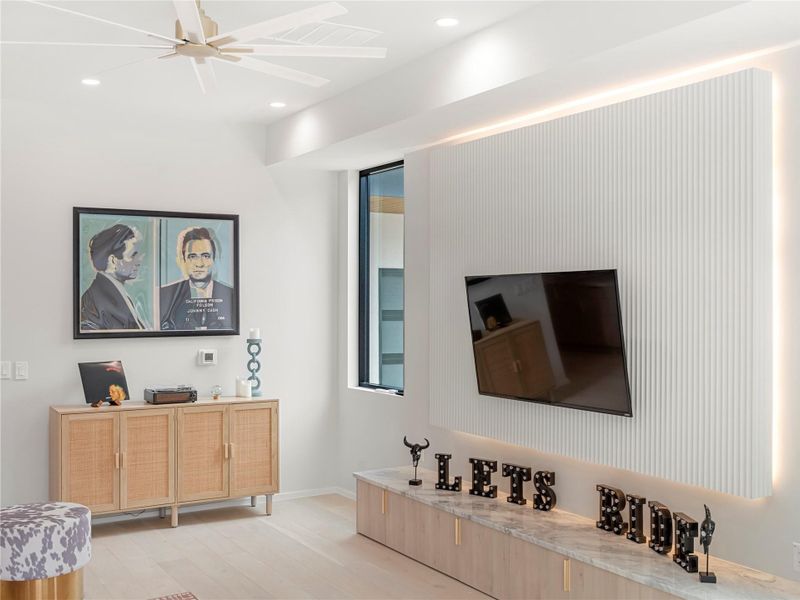 Bathroom with double vanity, light wood-style flooring, recessed lighting, and a ceiling fan