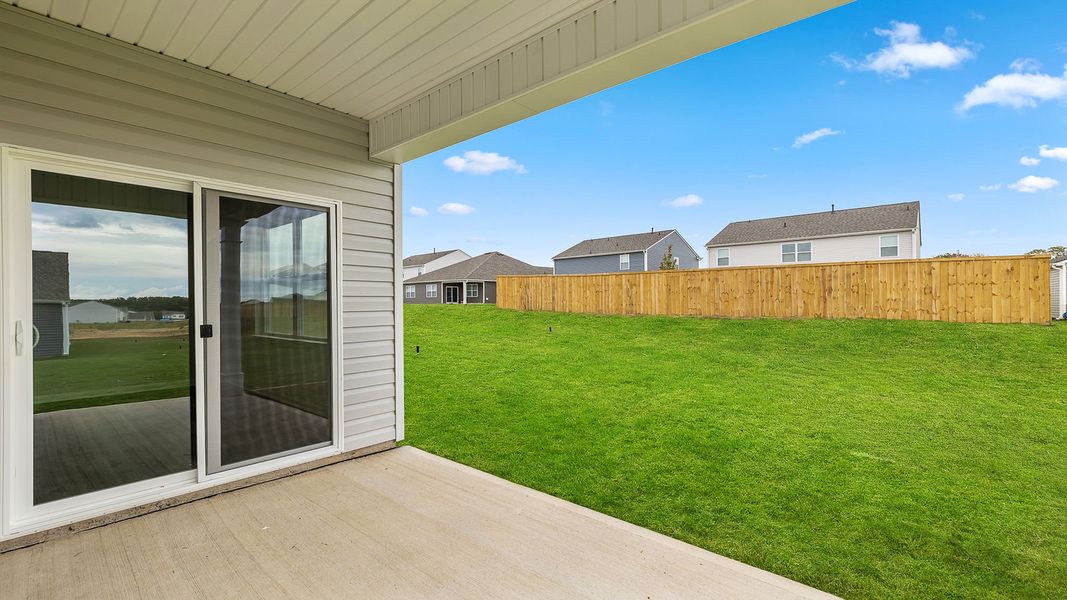 Exterior details and patio area of a home in Durbin Meadows Traditions, Fountain Inn (Image 14).