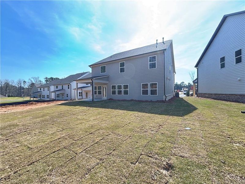 Exterior details and patio area of a home in Arbors at Richland Creek, Buford (Image 3).