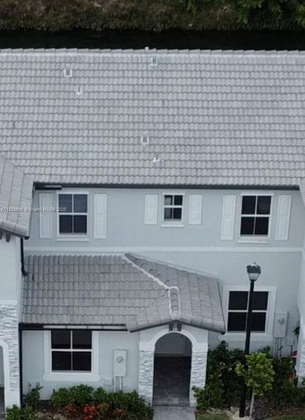 Front exterior of a new home in , Homestead, FL, highlighting curb appeal (Image 1). Front exterior of a new home in , Homestead, FL, highlighting curb appeal (Image 1).