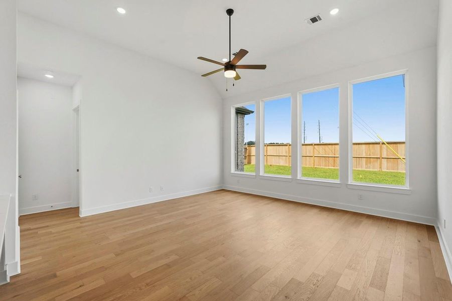 Family room has 4 large windows bringing in the natural light.