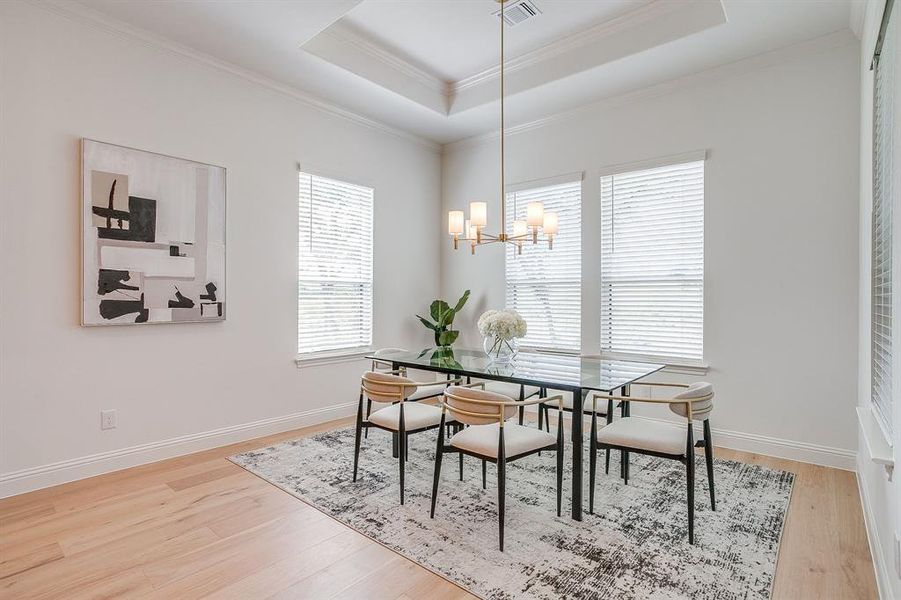 Dining area with decorative chandelier Dining area with decorative chandelier