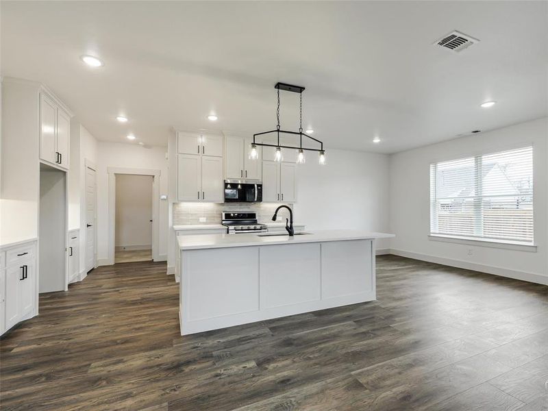 Kitchen with island and breakfast bar Kitchen with island and breakfast bar
