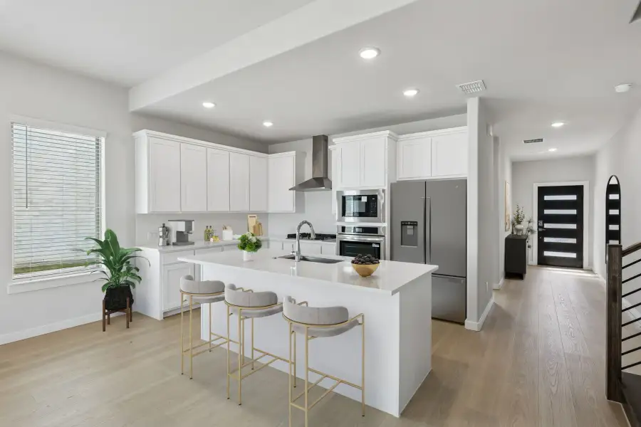 Kitchen in the Stanley II home plan by Trophy Signature Homes – REPRESENTATIVE PHOTO