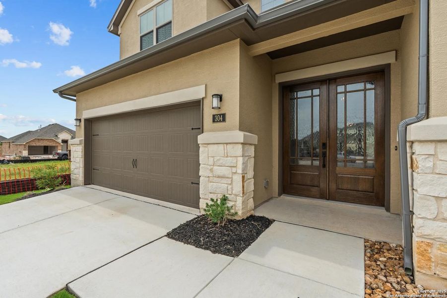 Front exterior of a new home in Legacy at Lake Dunlap, New Braunfels, TX, highlighting curb appeal (Image 23).