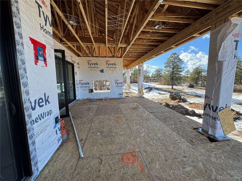 Covered back deck w big views & fireplace.