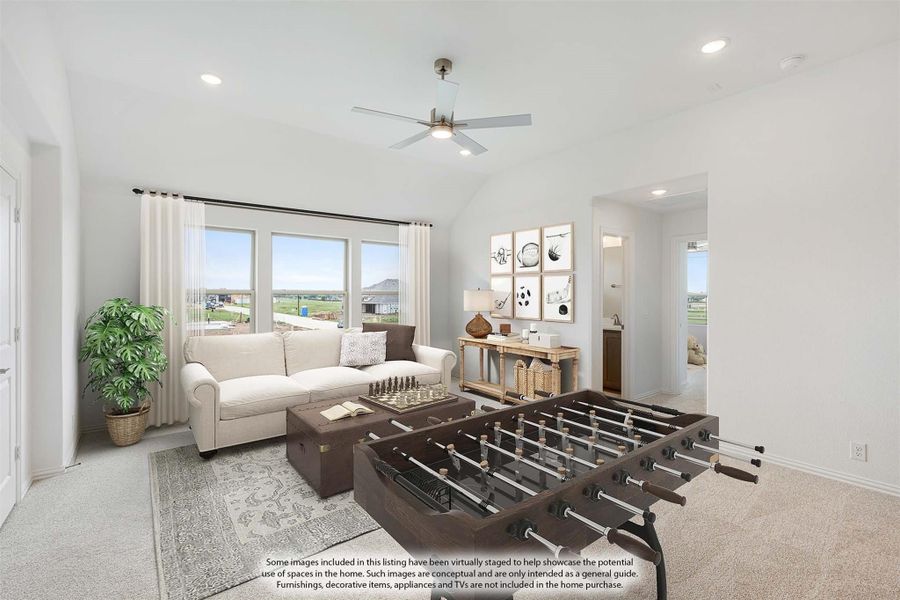 Bonus room with foosball table, sofa, ceiling fan, and large windows overlooking open land Bonus room with foosball table, sofa, ceiling fan, and large windows overlooking open land