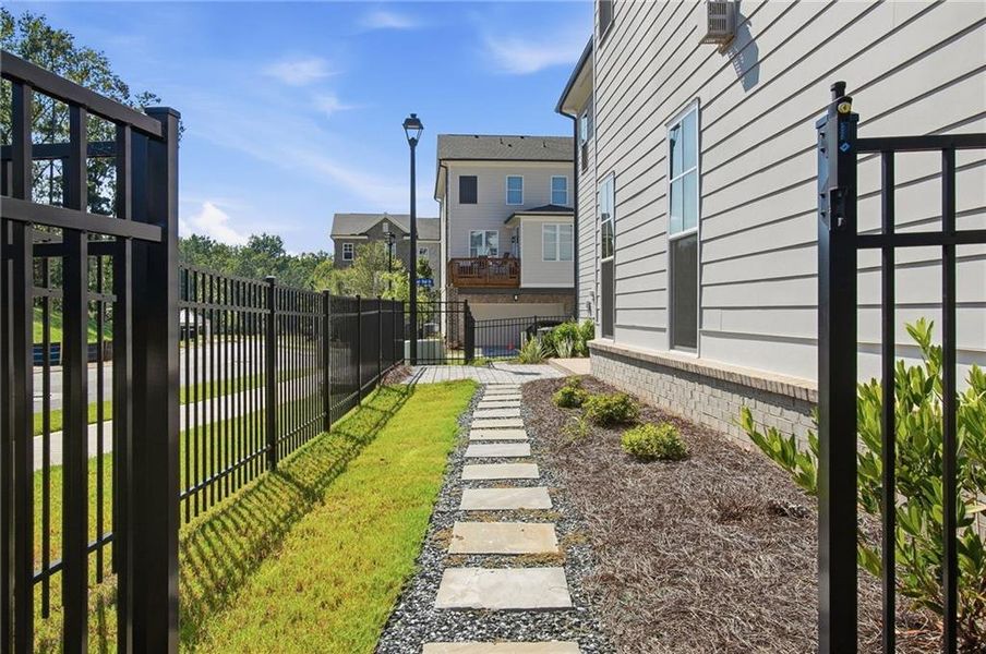 Exterior details and patio area of a home in Waterside Single Family, Peachtree Corners (Image 17).