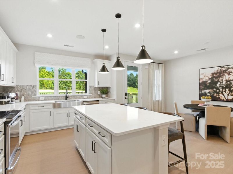 Designer Pendant Lighting Adds Flare to the Kitchen. *Model Photos | Actual Finishes, Structural Selections, and Orientation May Vary.
