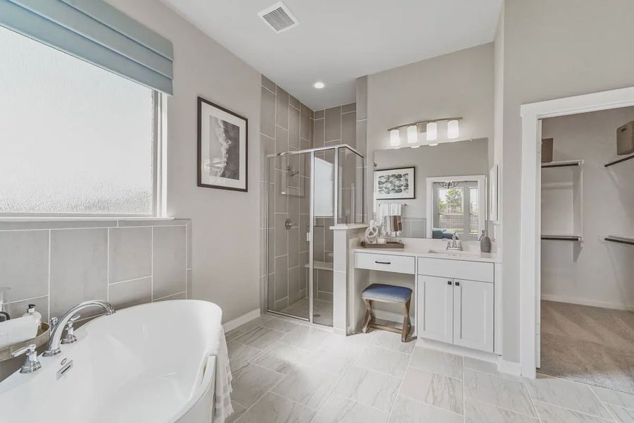 Representative furnished interior of a home built from the Montgomery by Chesmar Homes in Meridiana 50's and 60's, Manvel (Image 13).