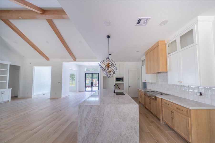 View from breakfast room showcasing the seamless flow from kitchen to family room