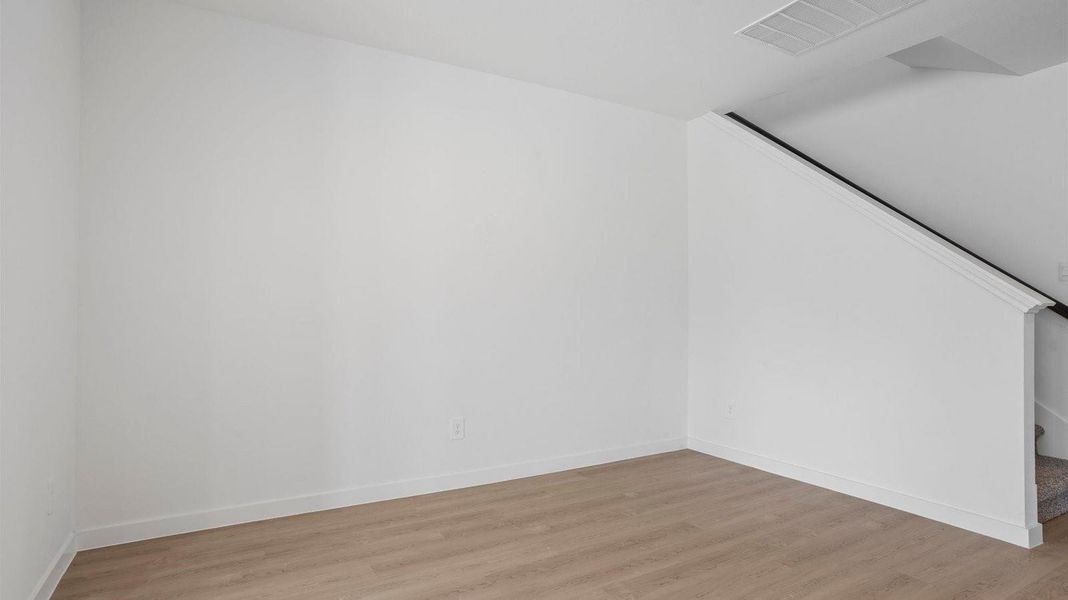 Spacious, unfurnished interior of a new home in Caldwell Crossing, Iowa Colony (Image 15).