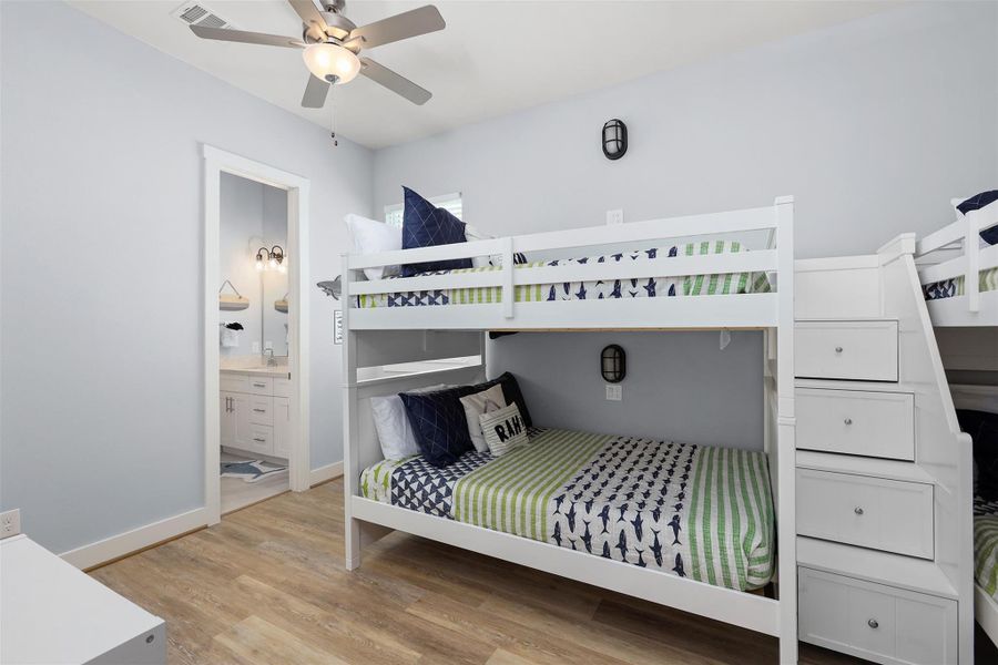 The second-floor bunk room is full of personality and space, with twin-over-twin and full-over-full beds that comfortably accommodate multiple guests.