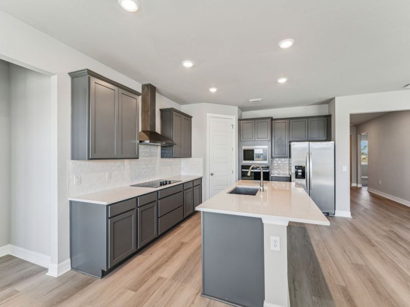 Furnished interior view inside a new home in Crescent Lakes - Signature Series, Punta Gorda (Image 7).