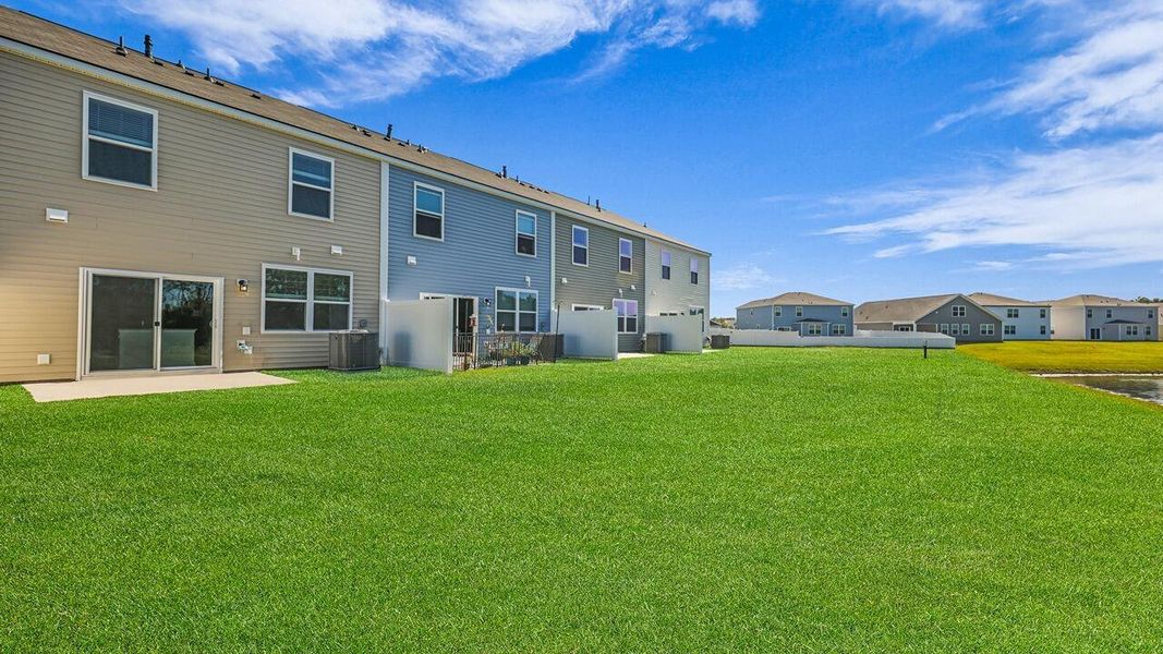 Exterior details and patio area of a home in Carolina Groves Townhomes, Moncks Corner (Image 2).