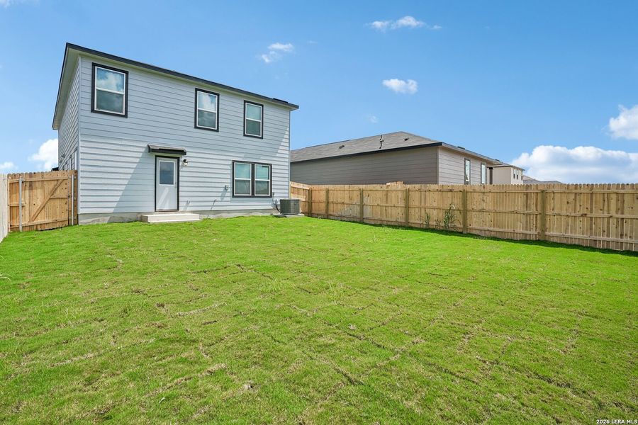 Exterior details and patio area of a home in Medina Crossing, Von Ormy (Image 20).