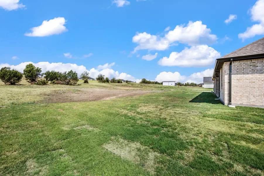 Exterior details and patio area of a home in Gatlin Ranch, Springtown (Image 4).