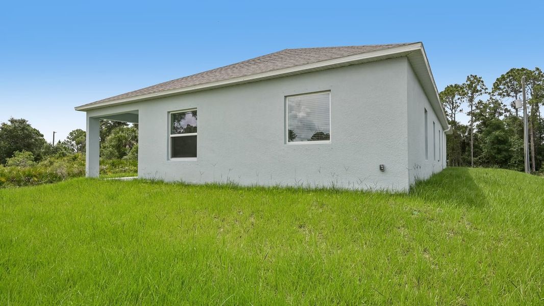 Exterior details and patio area of a home in Port Charlotte, Port Charlotte (Image 26).