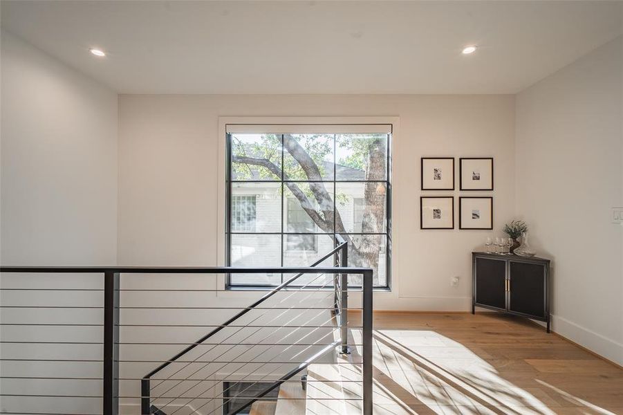 Staircase with hardwood / wood-style flooring