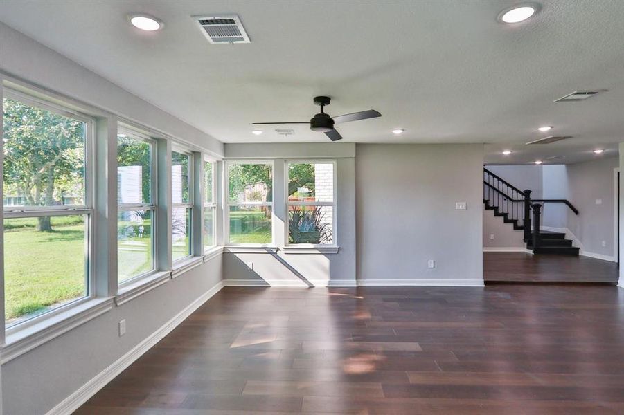 Style, Class and Sophistication. 5" baseboards surround the beautiful engineered wood floors from the den to the family room.