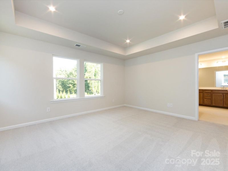 This tray ceiling enhances the space and provides a grand feel.