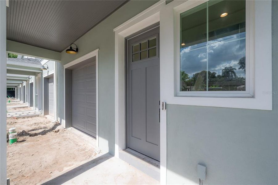 Each home has a covered entry. Specific finish colors may be differ. Photo is from another completed unit.