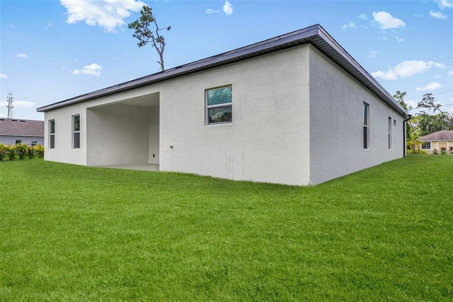 Front exterior of a new home in , North Port, FL, highlighting curb appeal (Image 2). Front exterior of a new home in , North Port, FL, highlighting curb appeal (Image 2).
