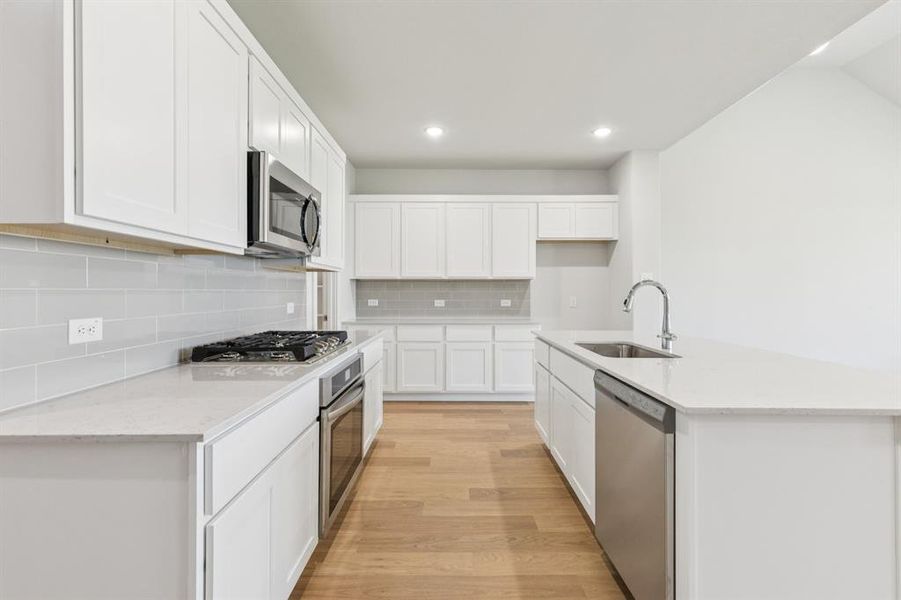 Kitchen in the Masters home plan by Trophy Signature Homes – REPRESENTATIVE PHOTO Kitchen in the Masters home plan by Trophy Signature Homes – REPRESENTATIVE PHOTO