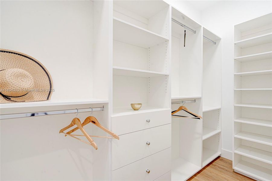 One of two large closets in the primary bedroom One of two large closets in the primary bedroom