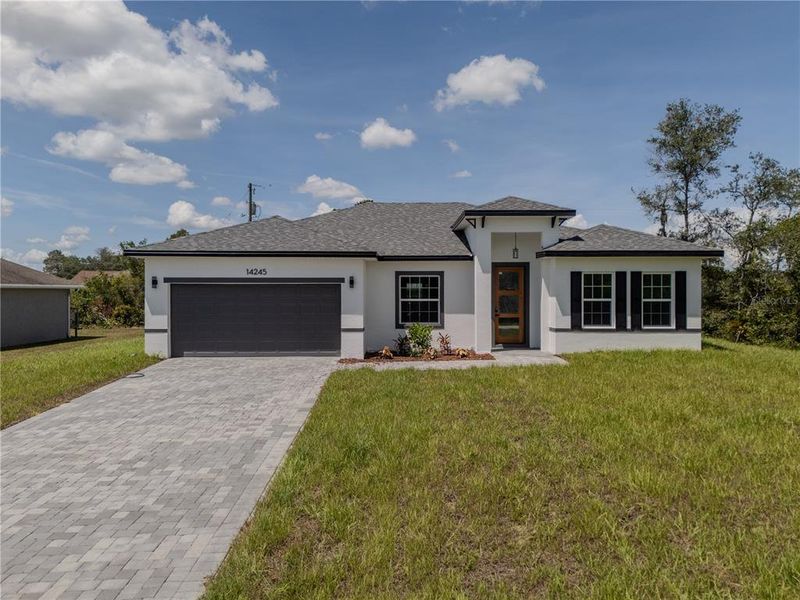 Front exterior of a new home in , Ocala, FL, highlighting curb appeal (Image 27).
