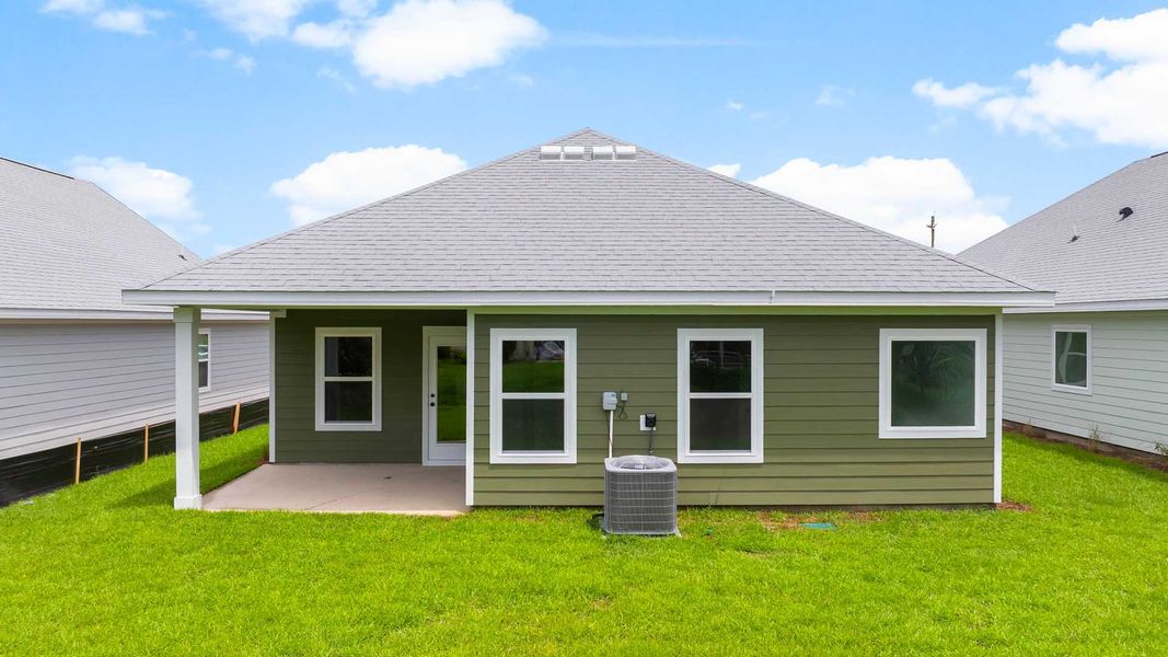 Front exterior of a new home in Caballeros Estates At Hombre, Panama City Beach, FL, highlighting curb appeal (Image 24). Front exterior of a new home in Caballeros Estates At Hombre, Panama City Beach, FL, highlighting curb appeal (Image 24).