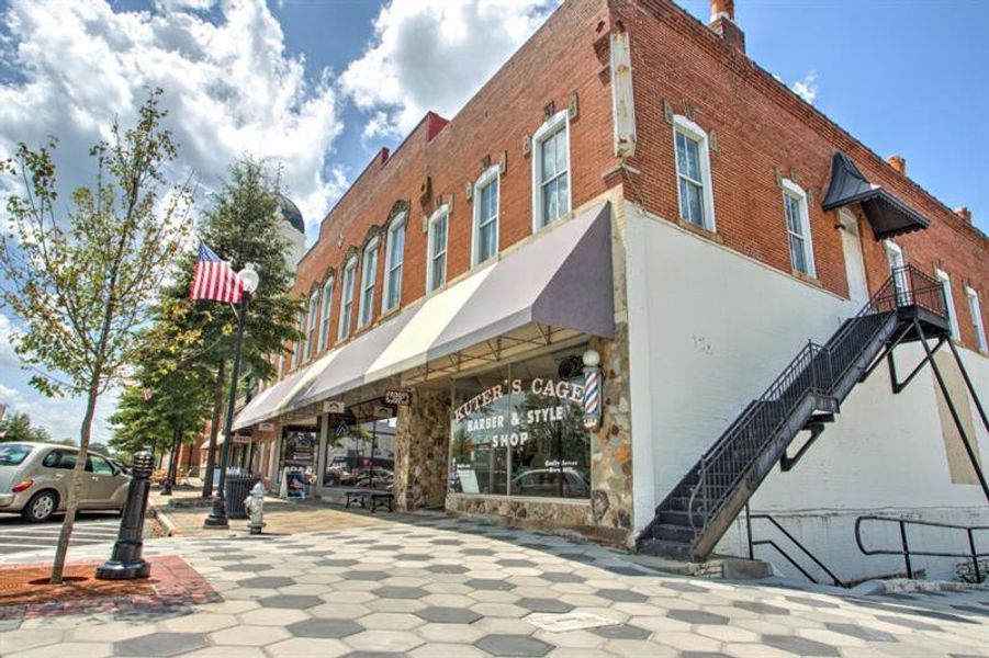 Front exterior of a new home in Pinegate, Covington, GA, highlighting curb appeal (Image 25).