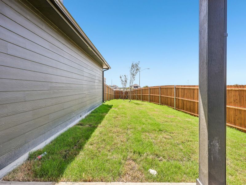 Exterior details and patio area of a home in Cibolo Hills West - Spring Series, Fort Worth (Image 3).