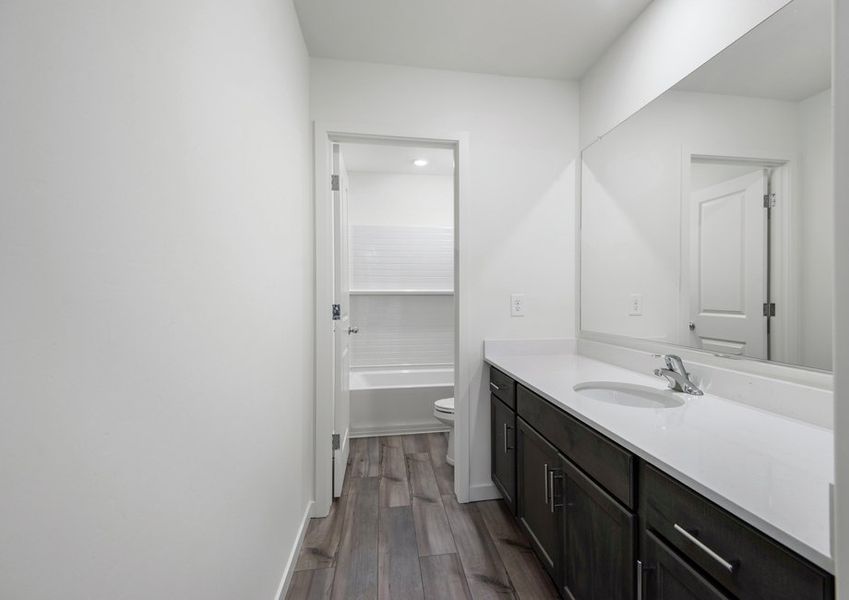 This bathroom offers a private area with a shower and tub combination.