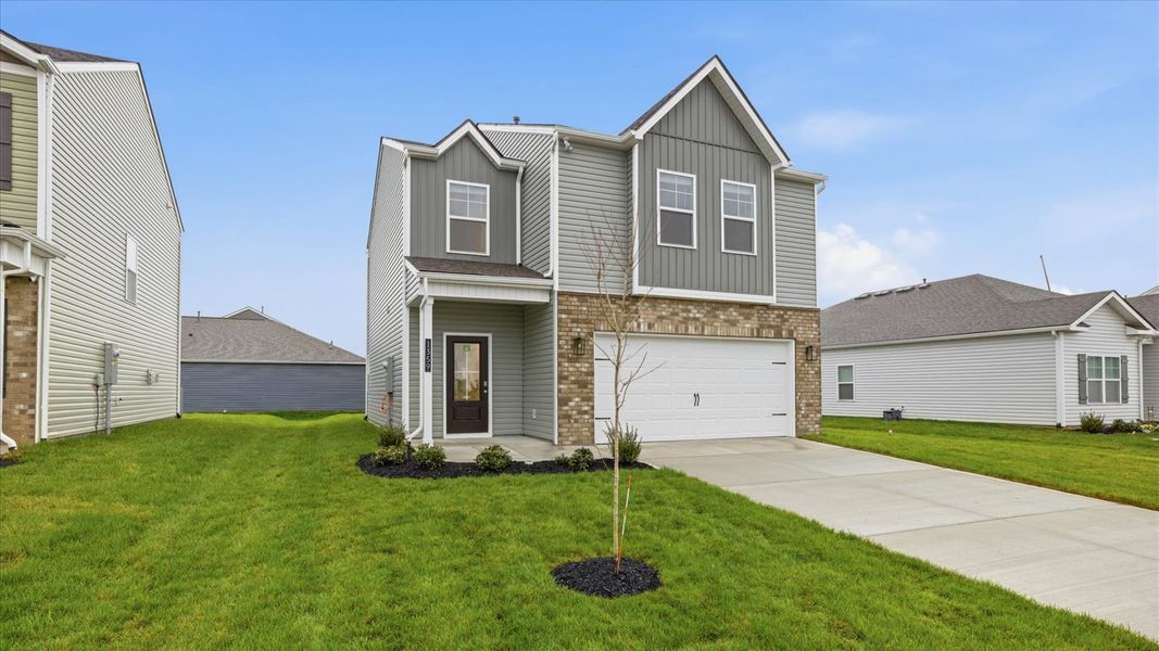 Front exterior of a new home in Best Farms, Maryville, TN, highlighting curb appeal (Image 2). Front exterior of a new home in Best Farms, Maryville, TN, highlighting curb appeal (Image 2).