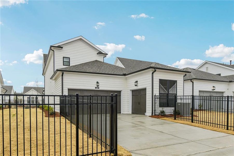 Front exterior of a new home in Promenade at Sawnee Village, Cumming, GA, highlighting curb appeal (Image 27).