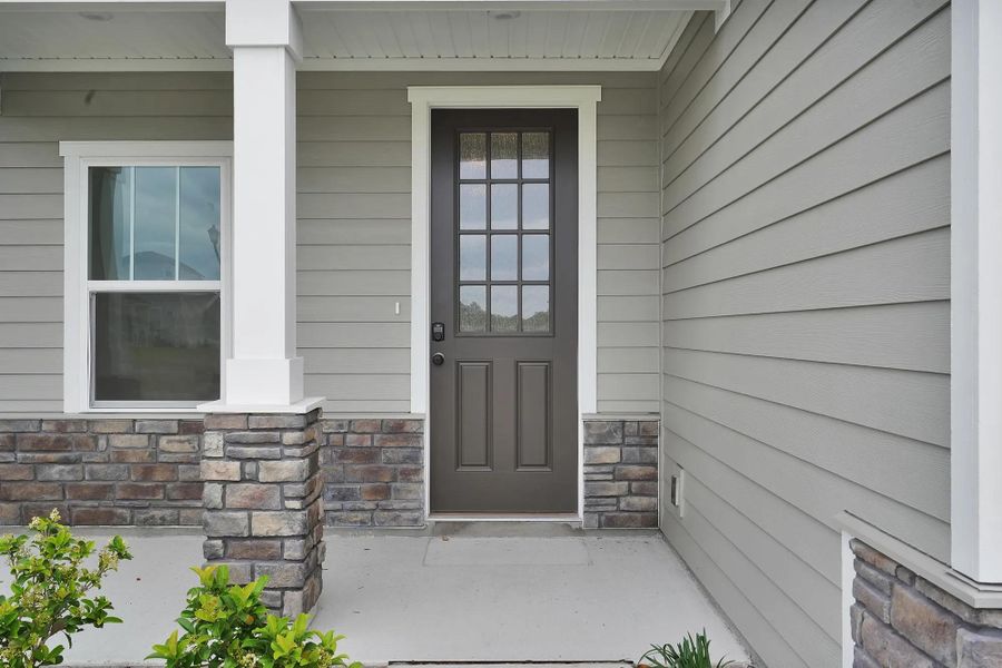 Representative exterior photo of a completed home built from the Heron by Drees Custom Homes in Edinburgh Village, Jacksonville, FL (Image 25).