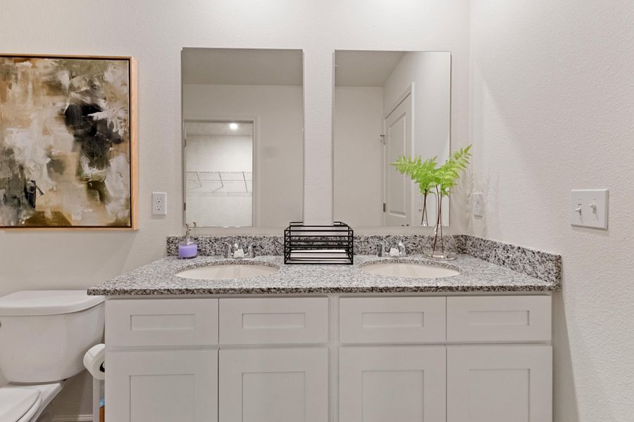 A bathroom with a marble countertop.