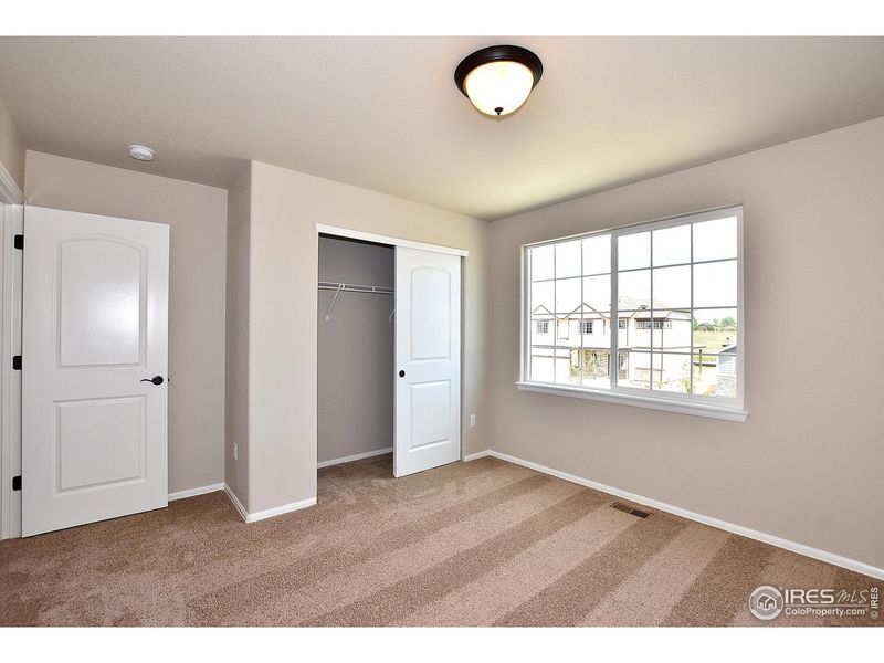 Spacious, unfurnished interior of a new home in Union Colony West, Greeley (Image 30).