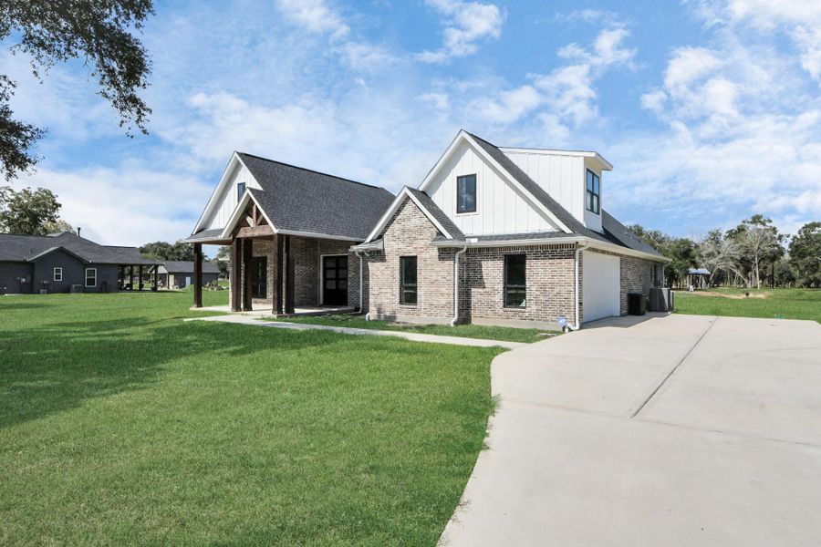 Front exterior of a new home in , Alvin, TX, highlighting curb appeal (Image 23). Front exterior of a new home in , Alvin, TX, highlighting curb appeal (Image 23).