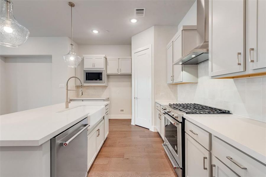 Furnished interior view inside a new home in Collin Creek, Plano (Image 7).