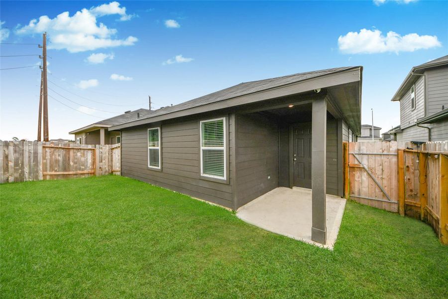Exterior details and patio area of a home in , Houston (Image 3).
